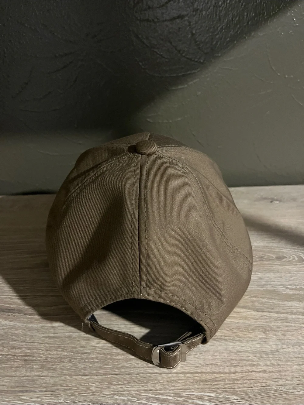 Brown Baseball Cap With Small Logo on Brim That Says “Sport Fashion”
